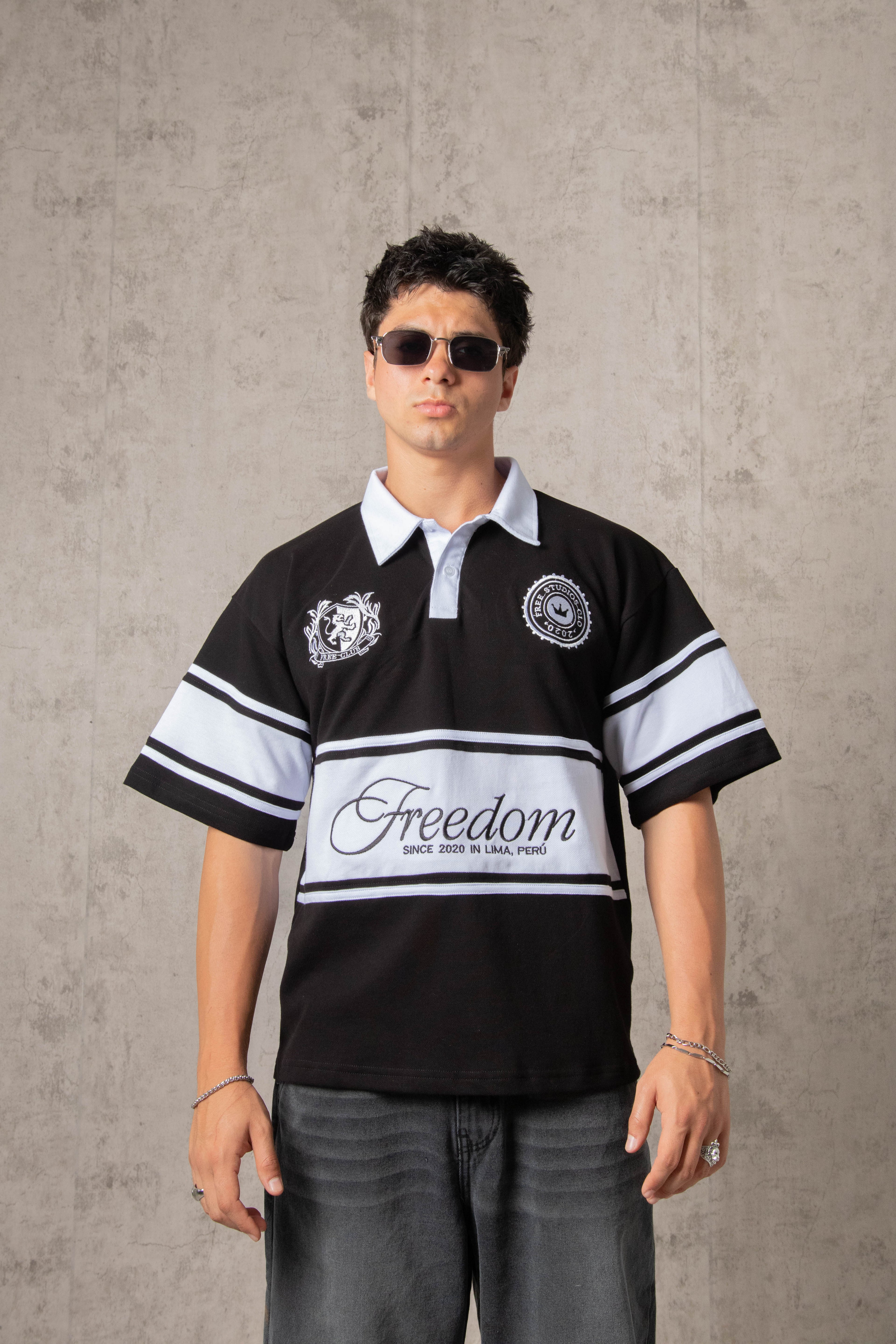 POLO PIQUÉ FREEDOM COLLEGE NEGRO