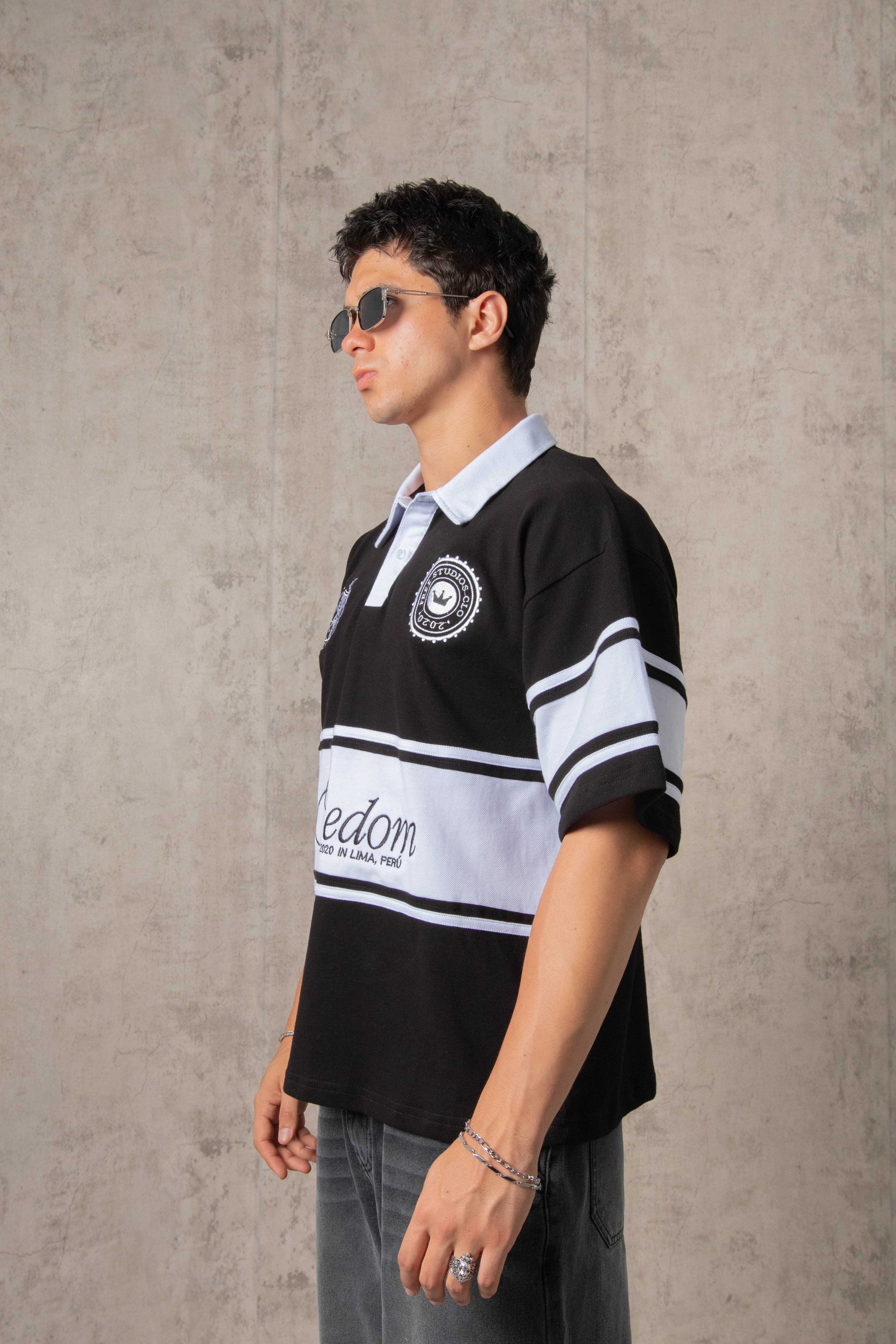 POLO PIQUÉ FREEDOM COLLEGE NEGRO